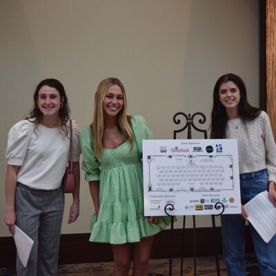Audrey Cook, Claire Crocker, and Grace Bannister assisting guests at the Community Foundation Awards