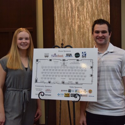 Taryn Robinson and Luke Paquette assisting guests at the Community Foundation Awards