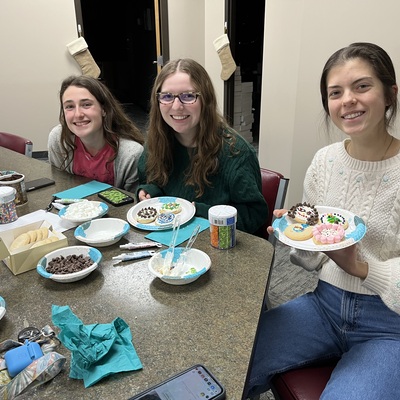 Audry Cook, Carys Carver, and Grace Bannister decorating cookies at the YIC Holiday party